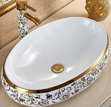 Golden pattern oval wash basin